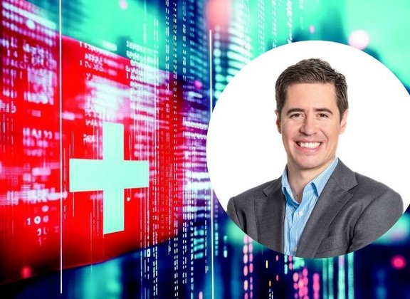 Business professional in front of techthemed Swiss flag